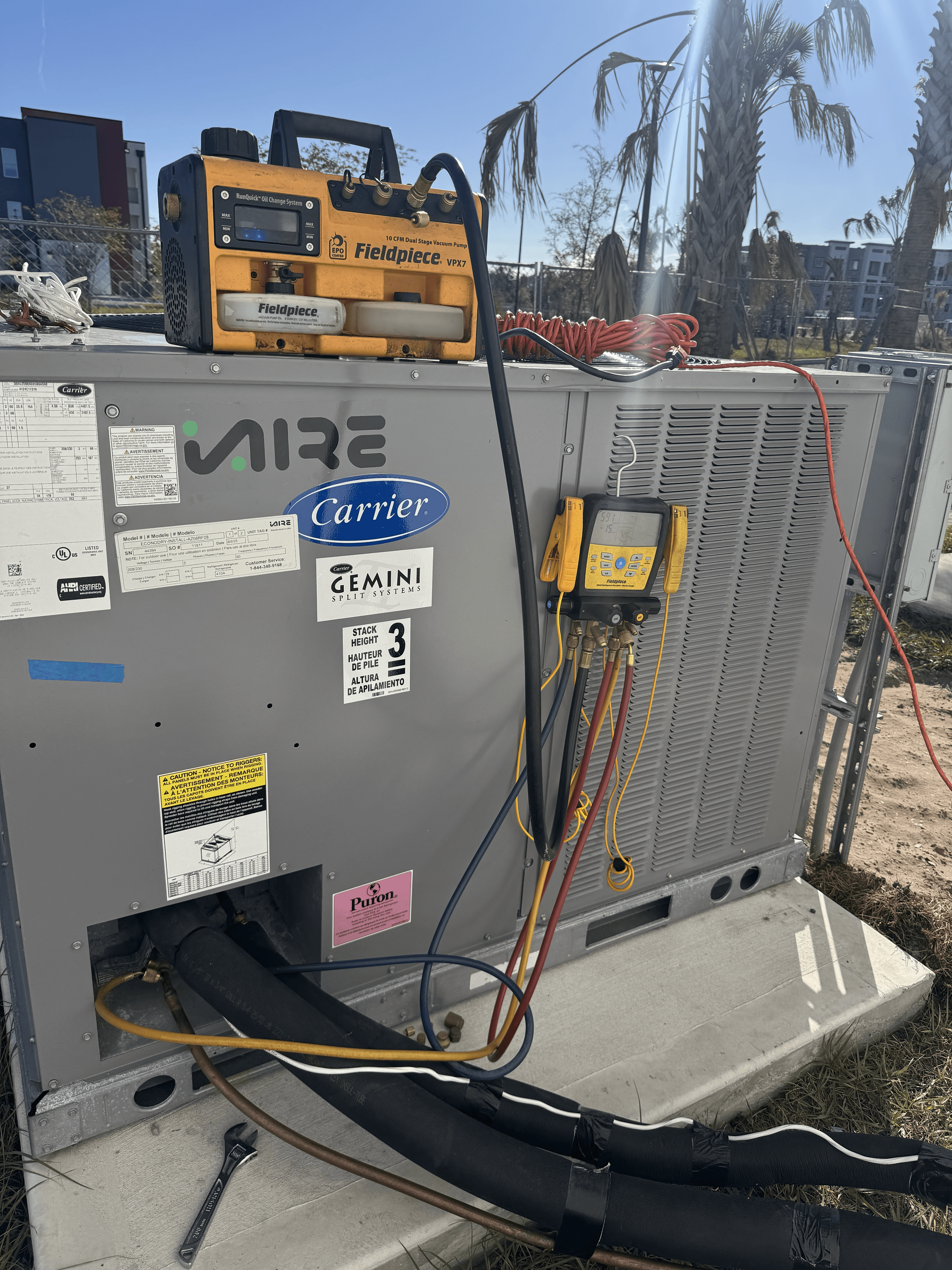 Commercial HVAC diagnostic setup with Fieldpiece recovery and manifold tools